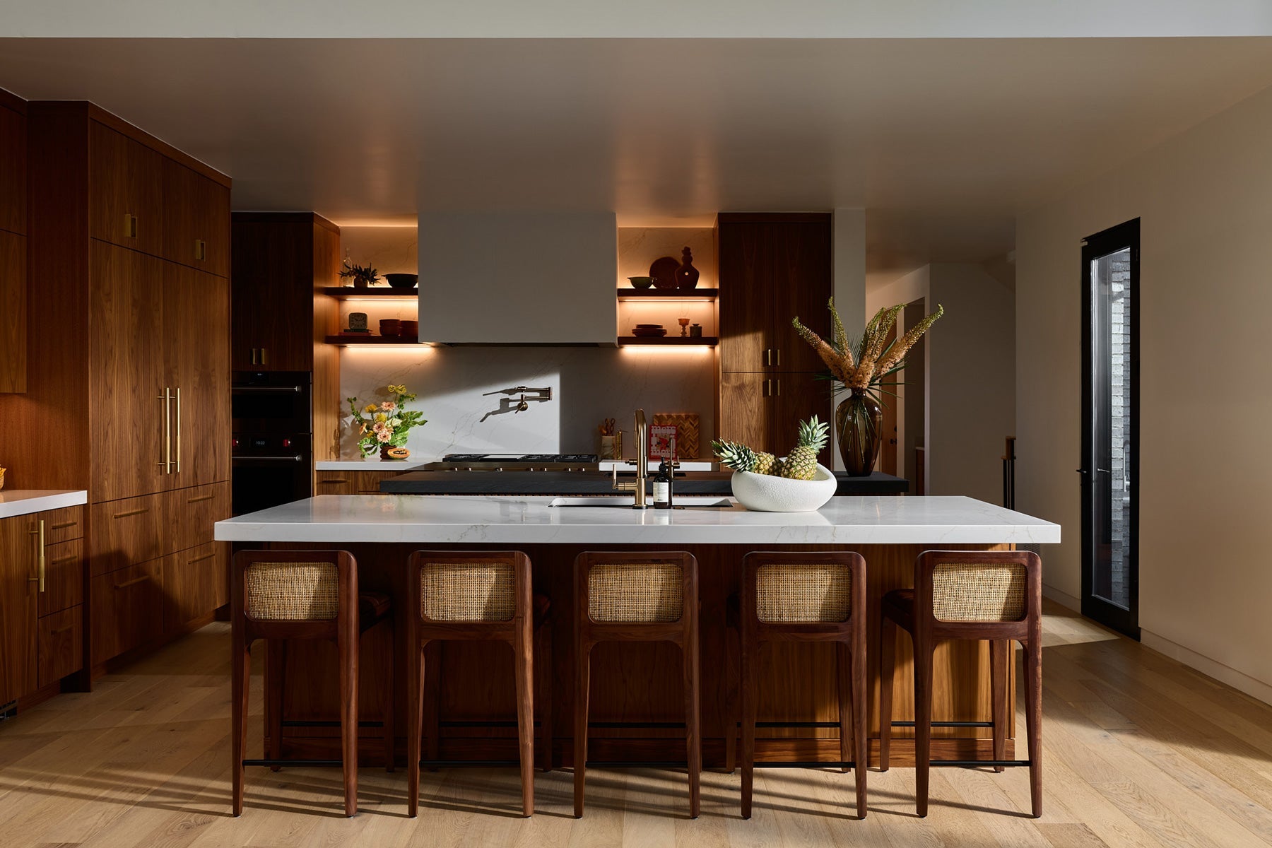 Canyon Counter Stools featuring solid wood frames and woven backs in a modern kitchen