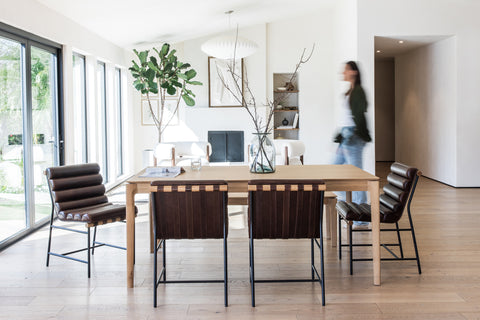 a dining table and chairs in a room