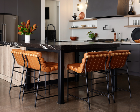 a kitchen with a table and chairs