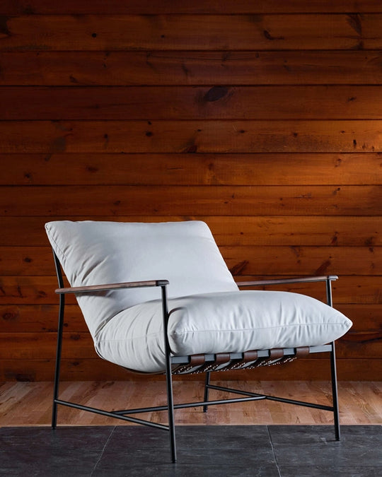 a chair in front of a wood wall