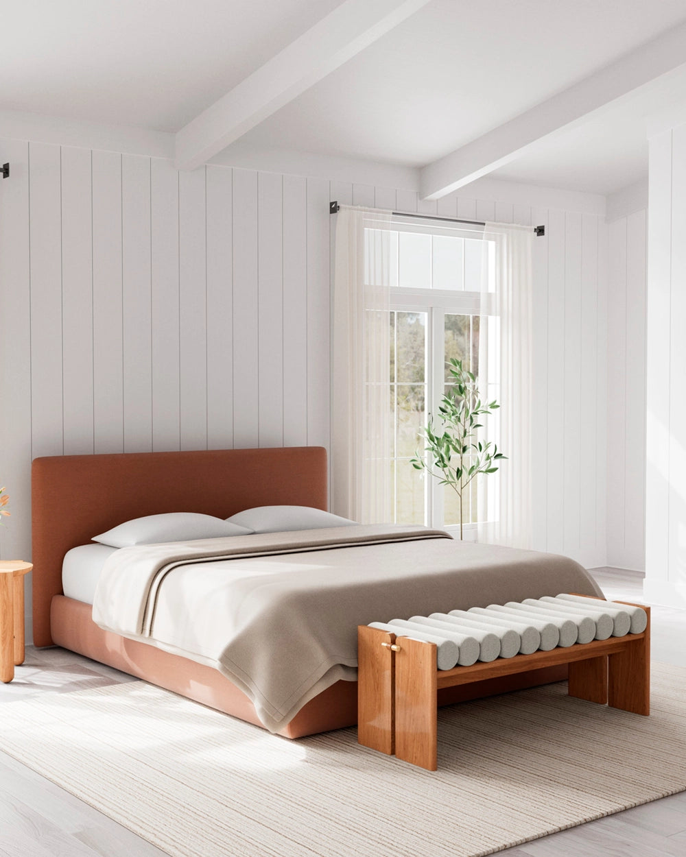 Jasper Bench featuring sculptural wood legs and padded bolster seat in a modern bedroom