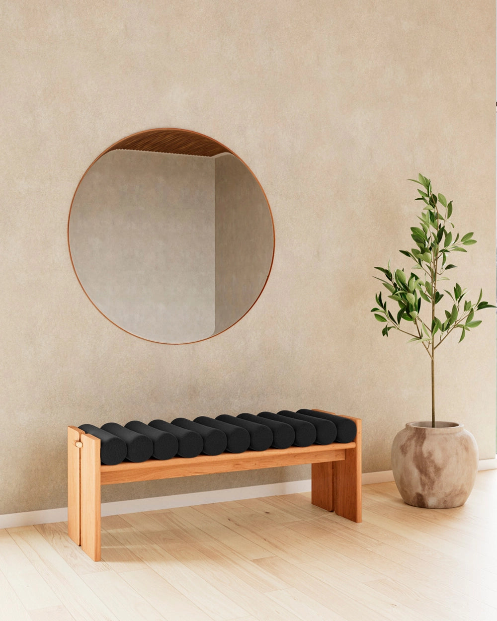 Jasper Bench with solid wood frame and upholstered cylindrical seat styled in an entryway