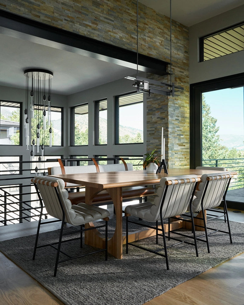 Modern dining room with wooden table and chairs in a well-lit room.
