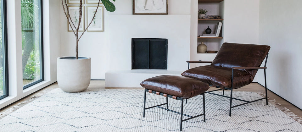 a chair and ottoman in a room