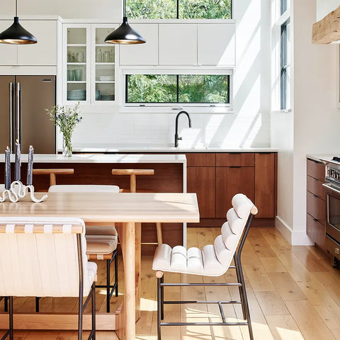 a kitchen with a table and chairs