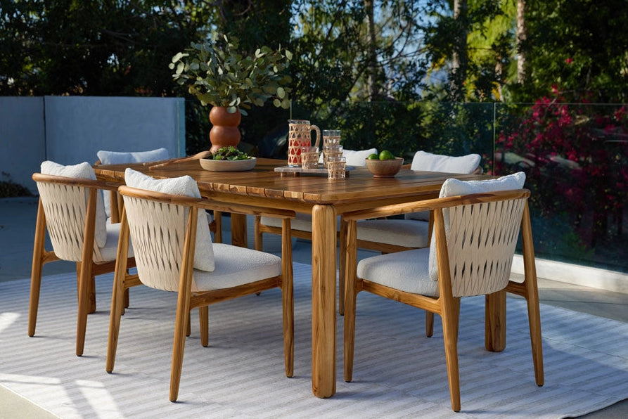 Outdoor Dillon Dining Table with Outdoor Dillon Dining Chairs on a patio