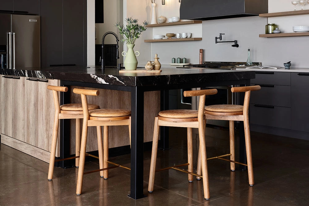 Modern kitchen with a black island and Range Counter Stools